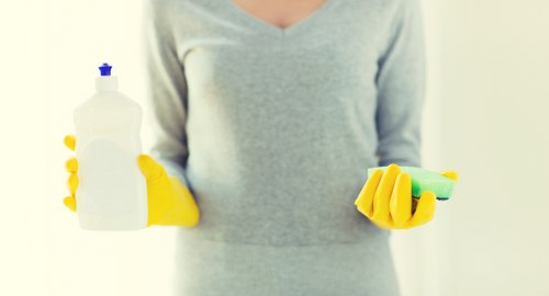 Technician using protective equipment during carpet cleaning
